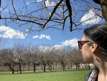 Portrait of man with sunglasses against trees