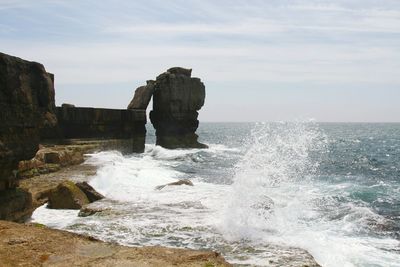 Waves splashing on rocks