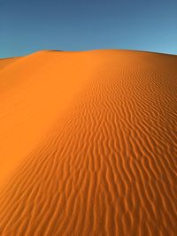 Scenic view of desert against clear sky