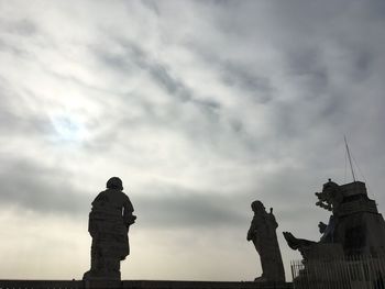 Low angle view of statue against sky