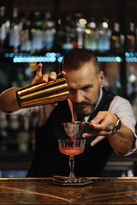 Man preparing food in bar