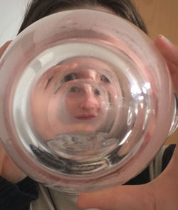 Close-up portrait of man holding glass