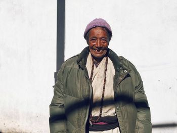 Portrait of smiling man standing in winter