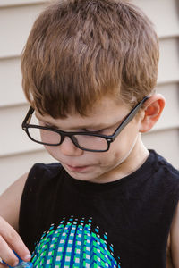 Close-up of boy wearing eyeglasses