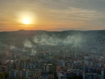 High angle view of cityscape against sky during sunset