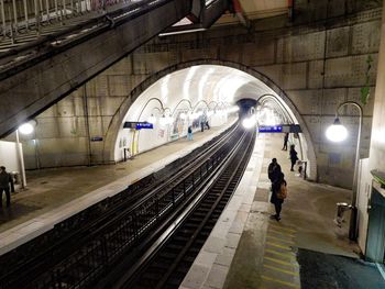 People waiting at railroad station