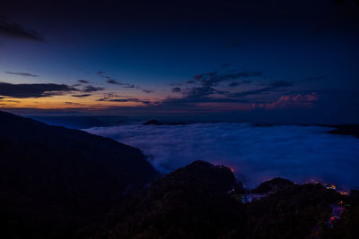 Scenic view of landscape against sky at night