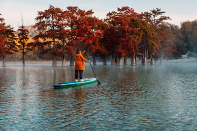 Man kayaking in lake