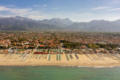 High angle view of townscape and mountains against sky