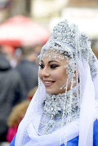 Close-up portrait of smiling young woman