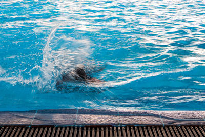 High angle view of man swimming in pool