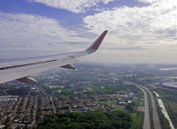 Aerial view of cityscape against sky