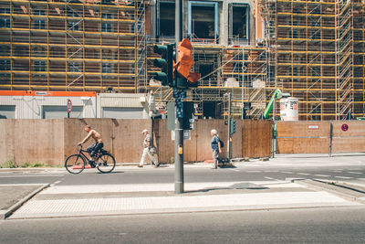 Man cycling on bicycle in city