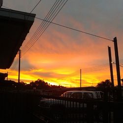 Silhouette city against sky during sunset