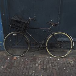 Old bicycle parked on wall