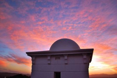 Low angle view of cloudy sky at sunset