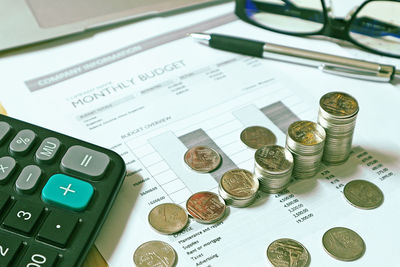 High angle view of coins on table