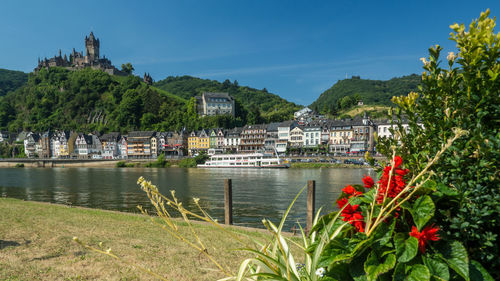 Scenic view of sea and buildings against sky