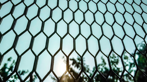 Full frame shot of chainlink fence against sky