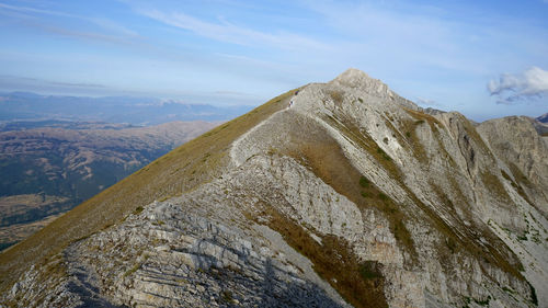 View of mountain range against cloudy sky
