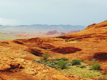 View of landscape with mountain range in the background