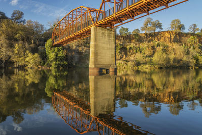 Bridge over lake against sky