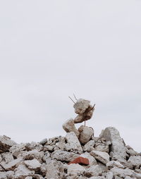 Broken concrete blocks against clear sky