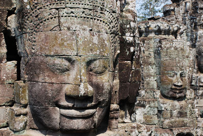 Statues on brick wall of temple