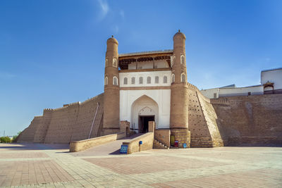 Low angle view of historic building against clear blue sky