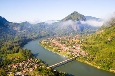 Scenic view of lake and mountains against sky