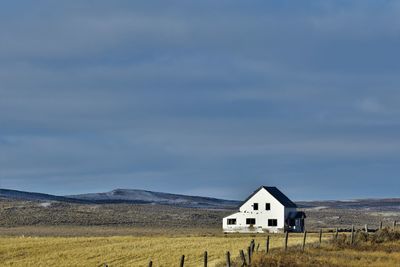 House on field against sky