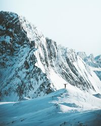 Scenic view of snowcapped mountains against clear sky