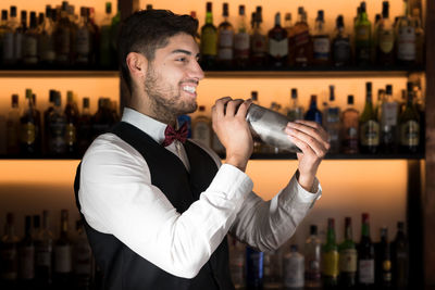 Young man drinking bottles