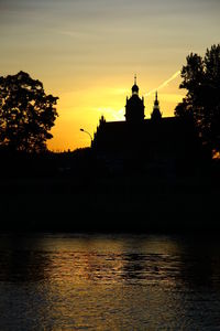 Silhouette of building at sunset