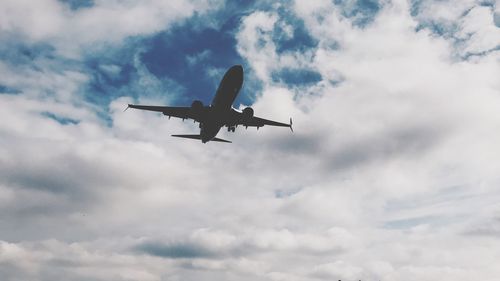 Low angle view of airplane against sky