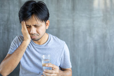 Midsection of man holding ice cream
