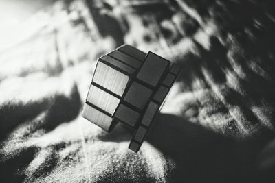 Close-up of puzzle cube on textile
