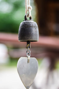 Close-up of bell hanging at temple