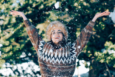 Portrait of young woman in snow