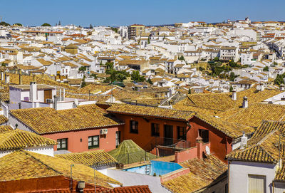High angle view of houses in city against sky