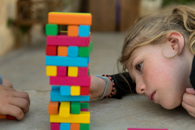 Close-up of girl playing with toys