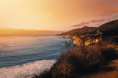 Scenic view of sea against sky during sunset