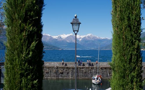 Scenic view of sea and mountains against sky