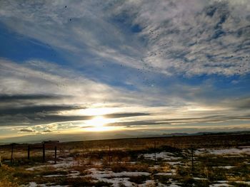 Scenic view of landscape against sky during sunset