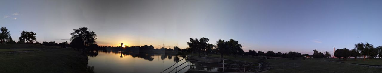 Panoramic view of trees against sky during sunset