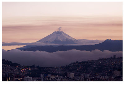 High angle shot of cityscape against mountain peak