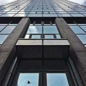 Low angle view of modern building against sky