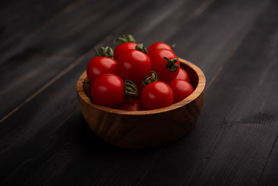 High angle view of tomatoes in basket on table