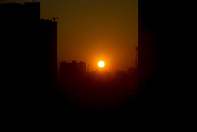 Silhouette of building at sunset