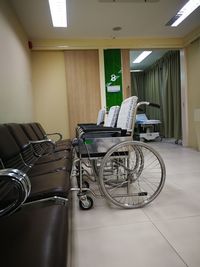 View of bicycles parked on tiled floor in building